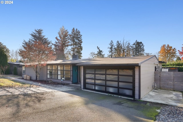 single story home featuring a garage