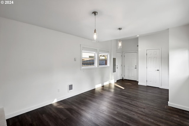 unfurnished room featuring dark hardwood / wood-style flooring