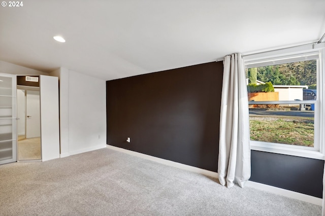 empty room featuring light carpet