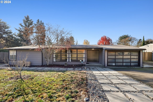 single story home featuring a garage