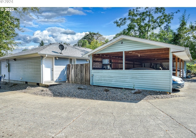 view of front of home featuring an outbuilding