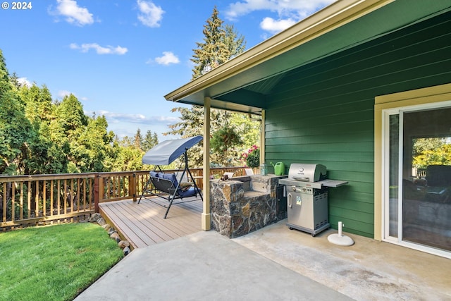 view of patio / terrace featuring a deck and grilling area