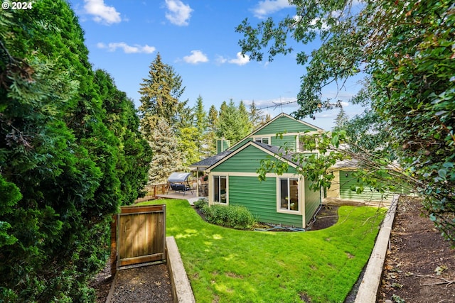 exterior space featuring a yard and a patio area