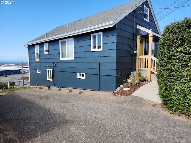 29840 Mary St, Gold Beach, OR 97444 - view of side of property featuring a shingled roof