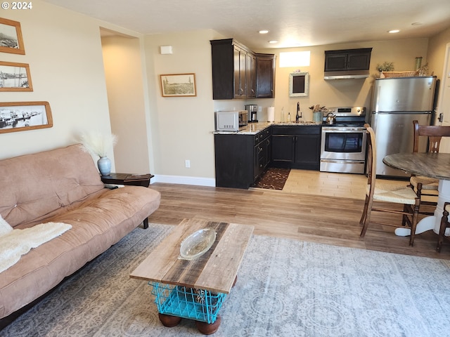 29840 Mary St, Gold Beach, OR 97444 - living room with light wood finished floors, recessed lighting, and baseboards