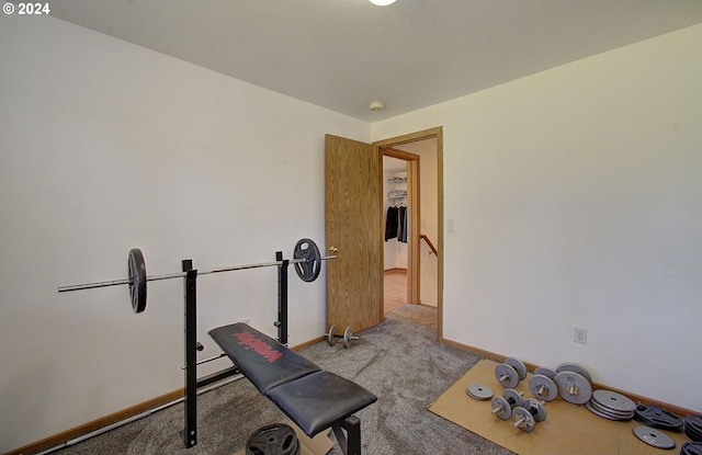 exercise room with light carpet