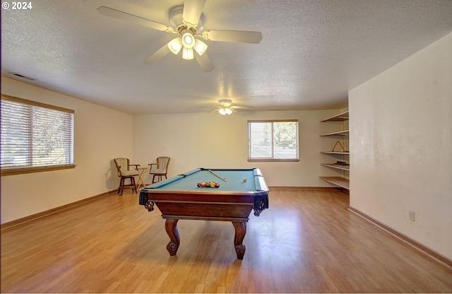 recreation room featuring a textured ceiling, light hardwood / wood-style flooring, ceiling fan, and billiards