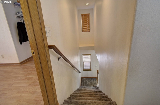 stairway with wood-type flooring