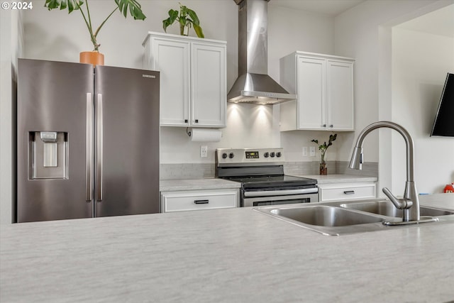 17347 NW Shackelford Rd, Portland, OR 97229 - kitchen featuring appliances with stainless steel finishes, a sink, wall chimney range hood, healthy amount of natural light, and recessed lighting