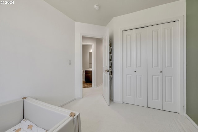 carpeted bedroom featuring a closet