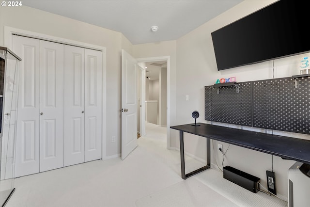 home office with light carpet and baseboards