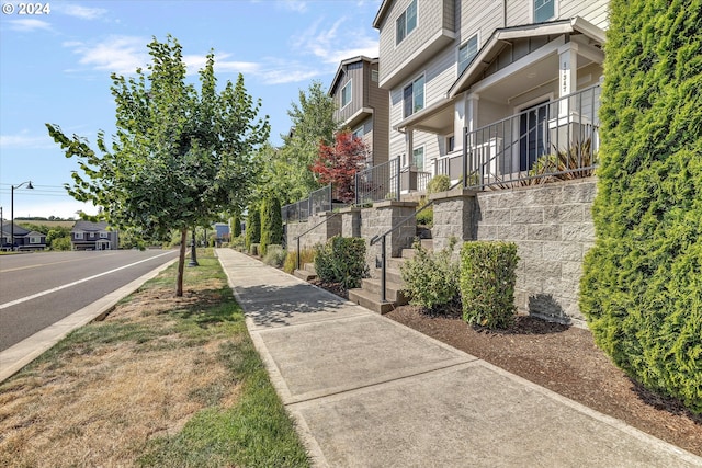 view of home's community with fence and a residential view