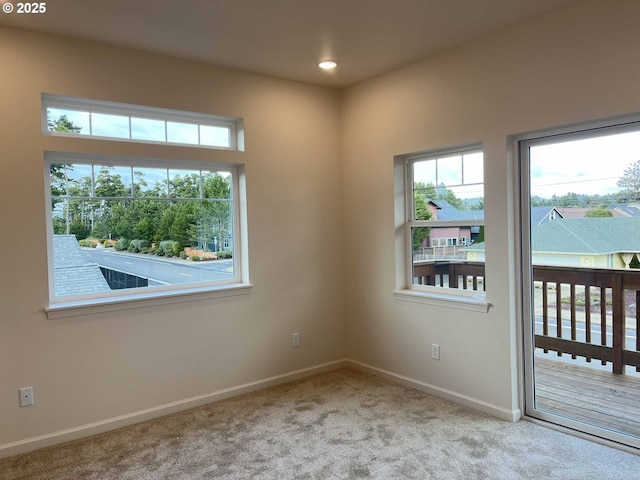 carpeted spare room with recessed lighting and baseboards