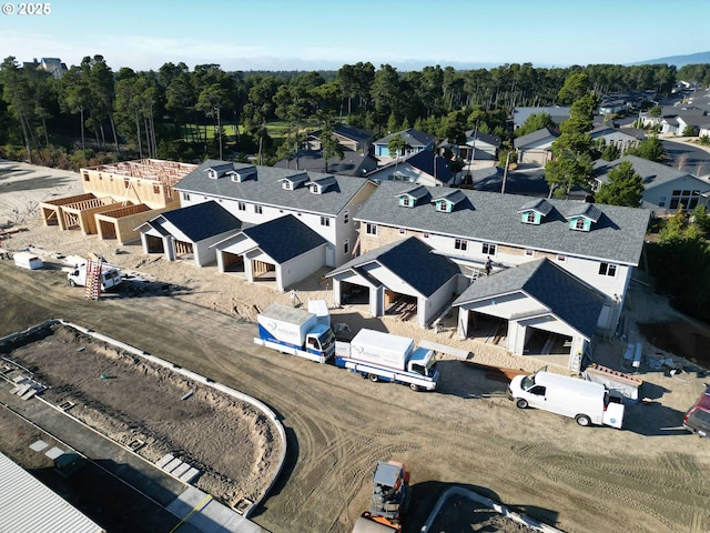 birds eye view of property with a residential view