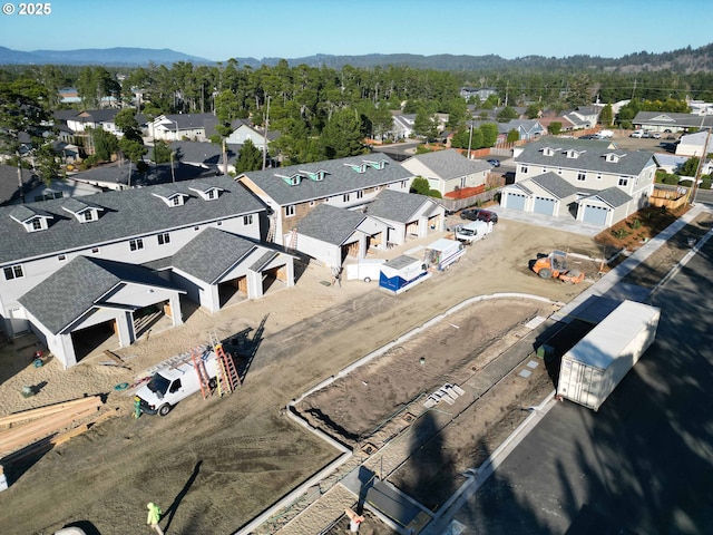 drone / aerial view with a residential view and a mountain view