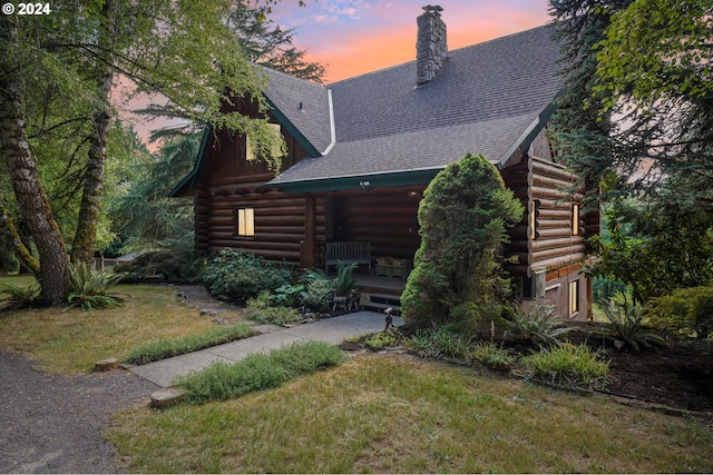 cabin with a yard and a porch