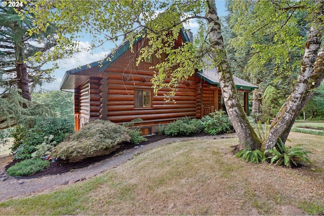 view of home's exterior featuring a lawn