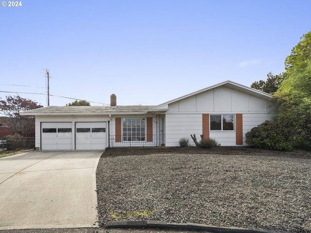 ranch-style house featuring a garage