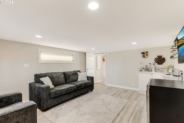 535 NE Bridgeton Rd Unit 7, Portland, OR 97211 - living room featuring light wood-style flooring, recessed lighting, and baseboards
