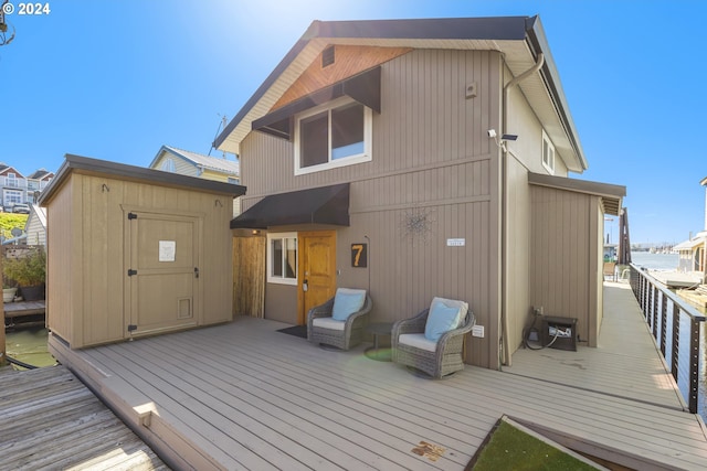 back of house featuring a wooden deck