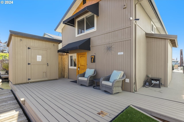 rear view of property with a wooden deck