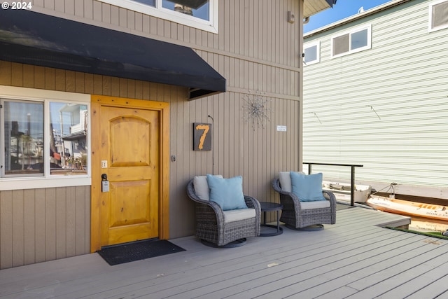 entrance to property with a wooden deck