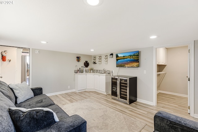 living room featuring light hardwood / wood-style floors and beverage cooler