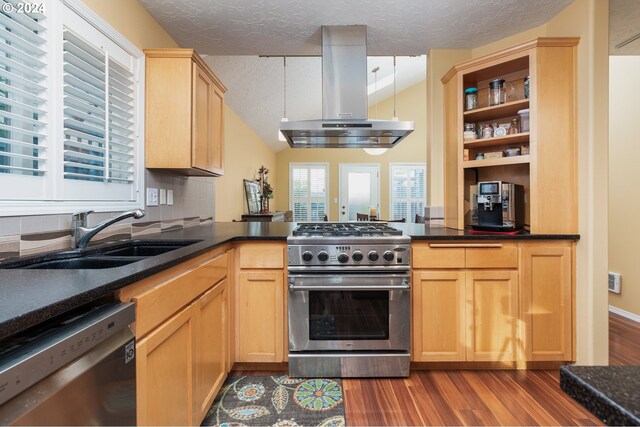 kitchen featuring tasteful backsplash, sink, stainless steel appliances, and light brown cabinets