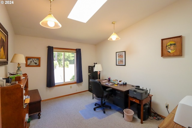 home office featuring lofted ceiling with skylight and carpet