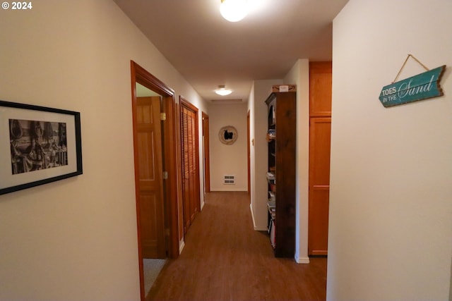 corridor with light hardwood / wood-style floors