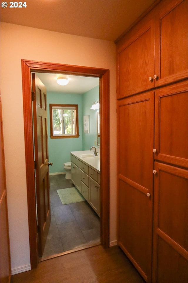 bathroom featuring vanity and toilet