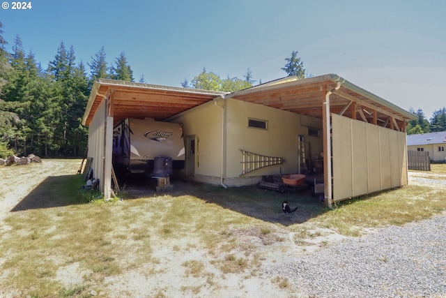 view of outbuilding featuring a carport