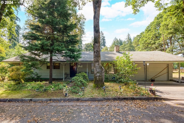 view of front of home with covered porch and a garage