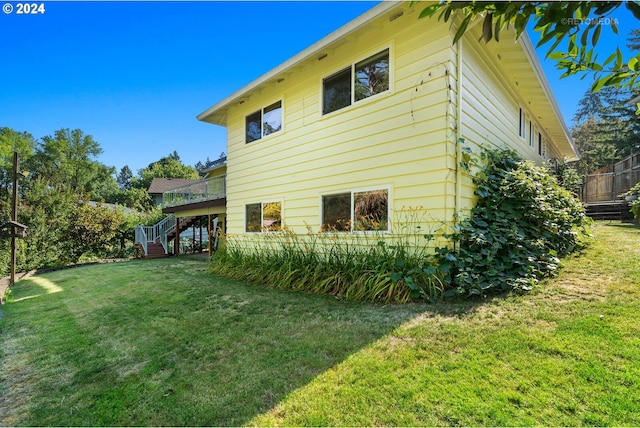 view of property exterior featuring a lawn