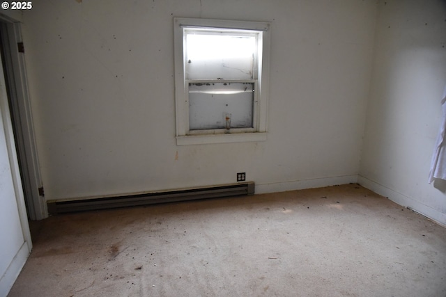 unfurnished room with baseboard heating