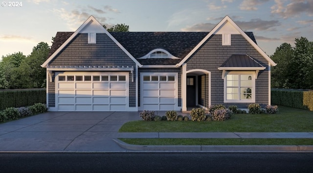 view of front of house with a lawn and a garage