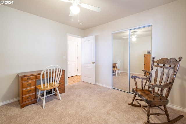 office with light carpet, baseboards, and a ceiling fan