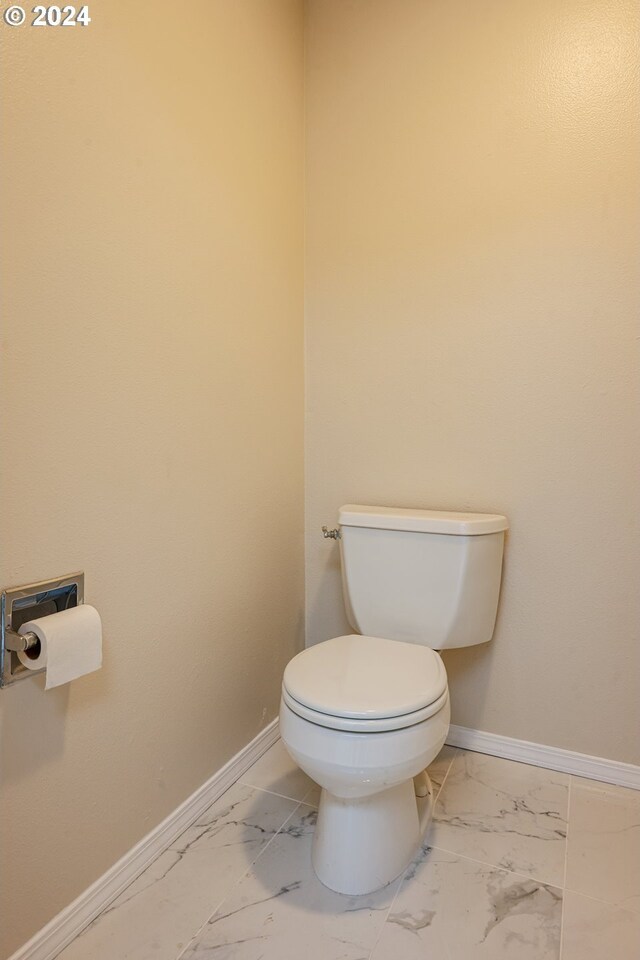 bathroom featuring toilet