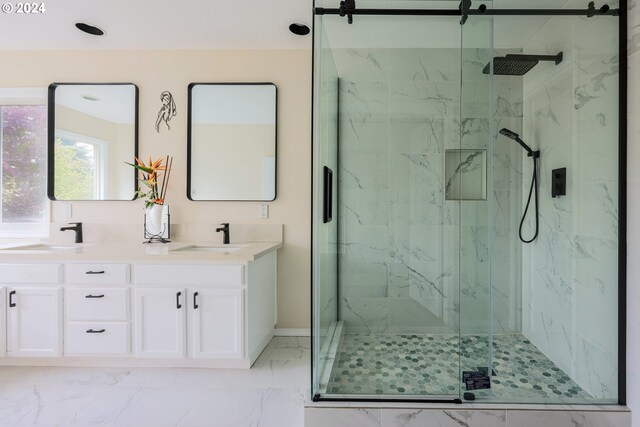 bathroom featuring vanity and a shower with shower door