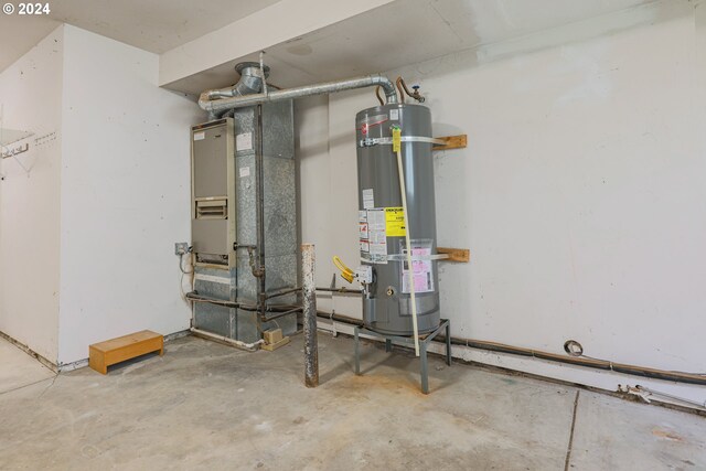 utility room featuring secured water heater