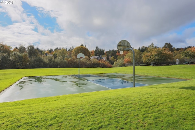 view of basketball court featuring a lawn