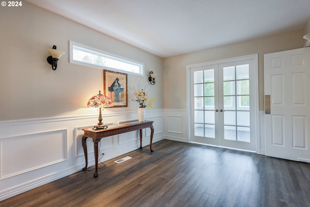 doorway to outside featuring french doors and dark hardwood / wood-style flooring