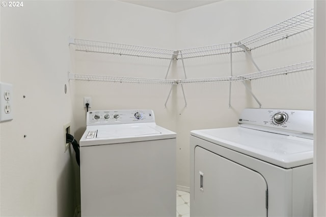 laundry room with independent washer and dryer