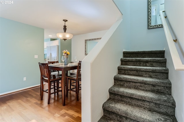 staircase featuring hardwood / wood-style floors