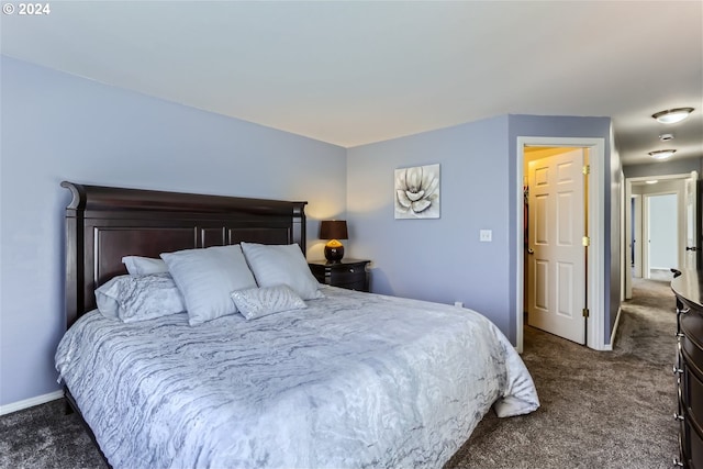 bedroom with dark carpet