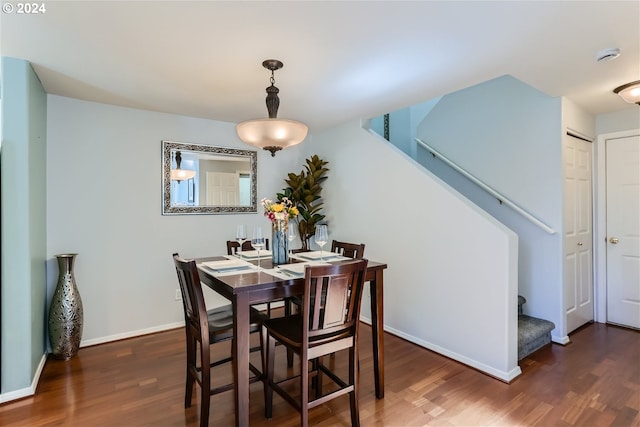 dining room with dark hardwood / wood-style flooring