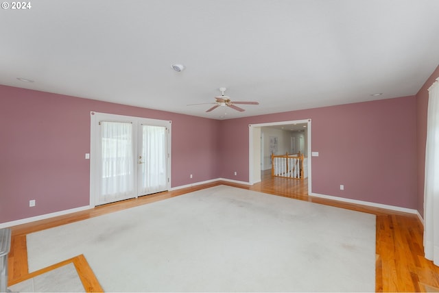 unfurnished room with ceiling fan and light hardwood / wood-style flooring