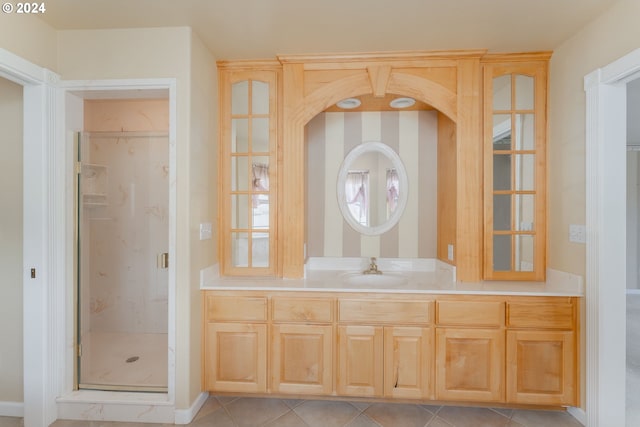 bathroom with vanity, an enclosed shower, and tile patterned floors