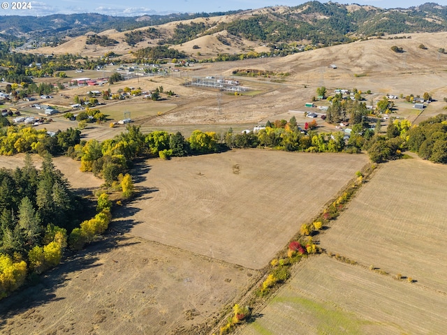 bird's eye view with a rural view and a mountain view