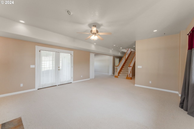 interior space with ceiling fan, french doors, and light colored carpet